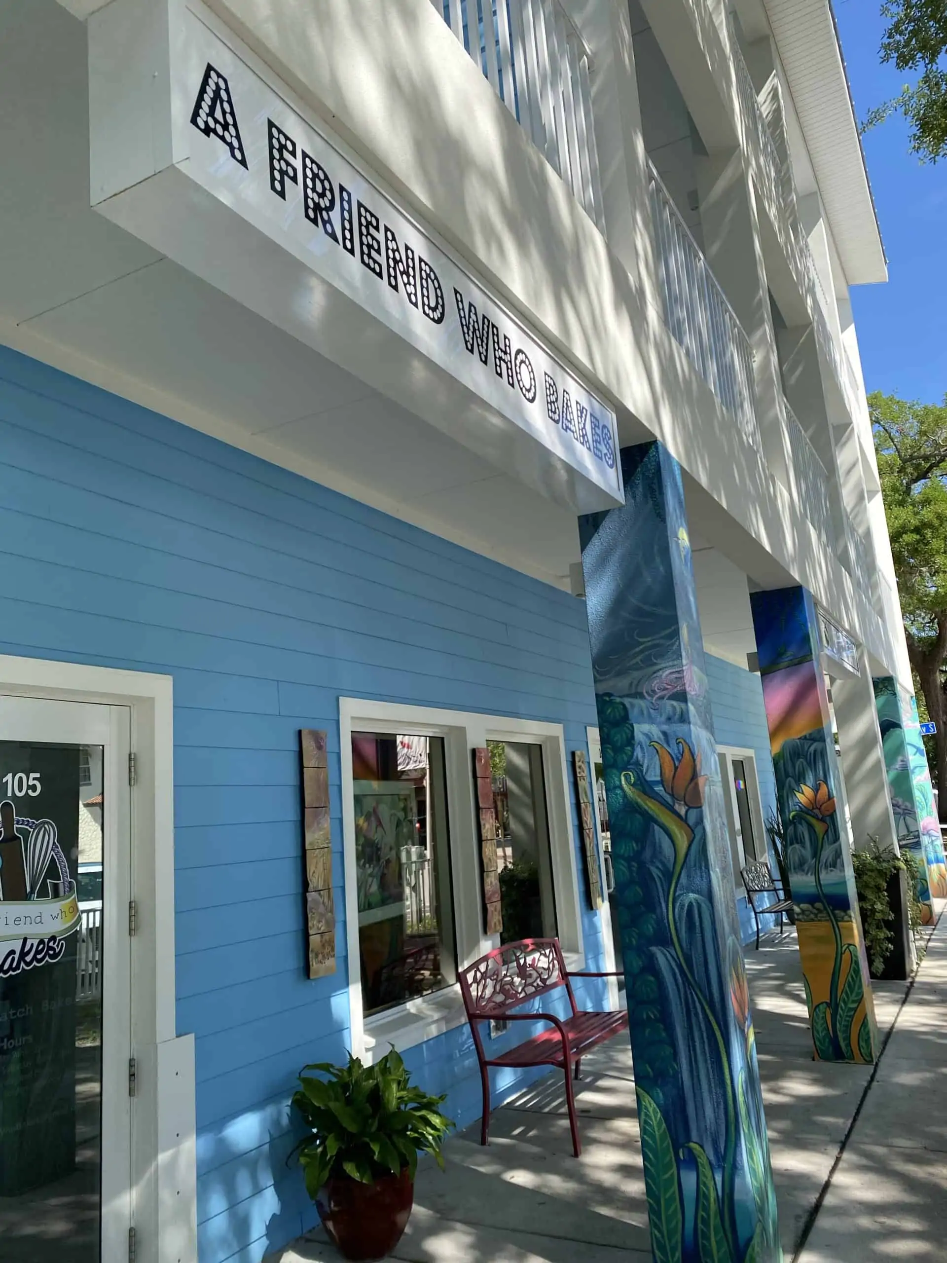 A friend who bakes business exterior is a cute blue building in the heart of downtown Gulfport Florida