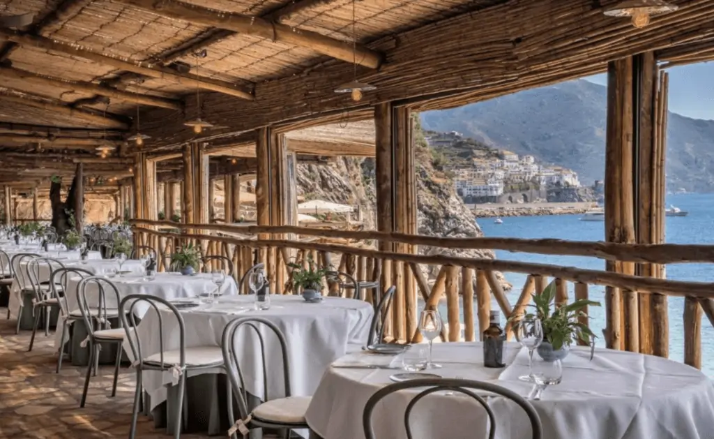  Boutique Hotels Amalfi Coast Hotel Caterina dining photo with white table cloths and sea views. 