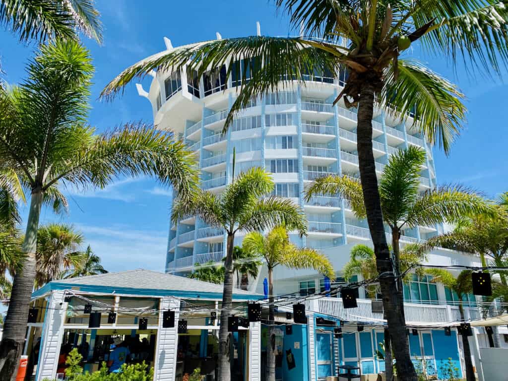 Bongos Beach Bar St Pete Beach FL has seating right between the palm trees and in the sandy beach.