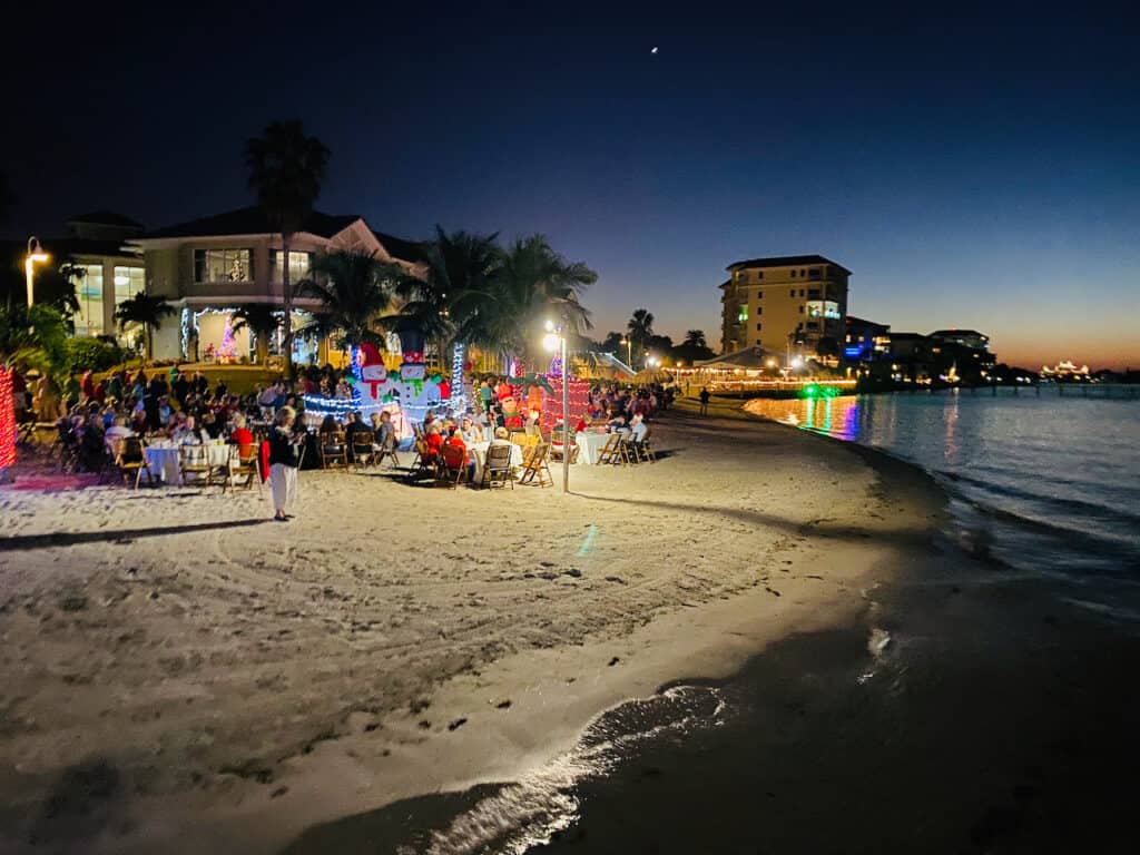 Christmas at the beach photo showing dinner at the beach and a Florida party with Christmas lights.