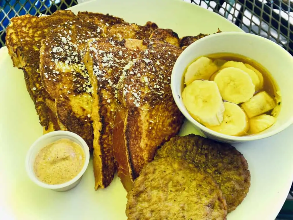 Bananas Foster French Toast at Stella's  with a side of bananas.  Breakfast in Gulfport FL