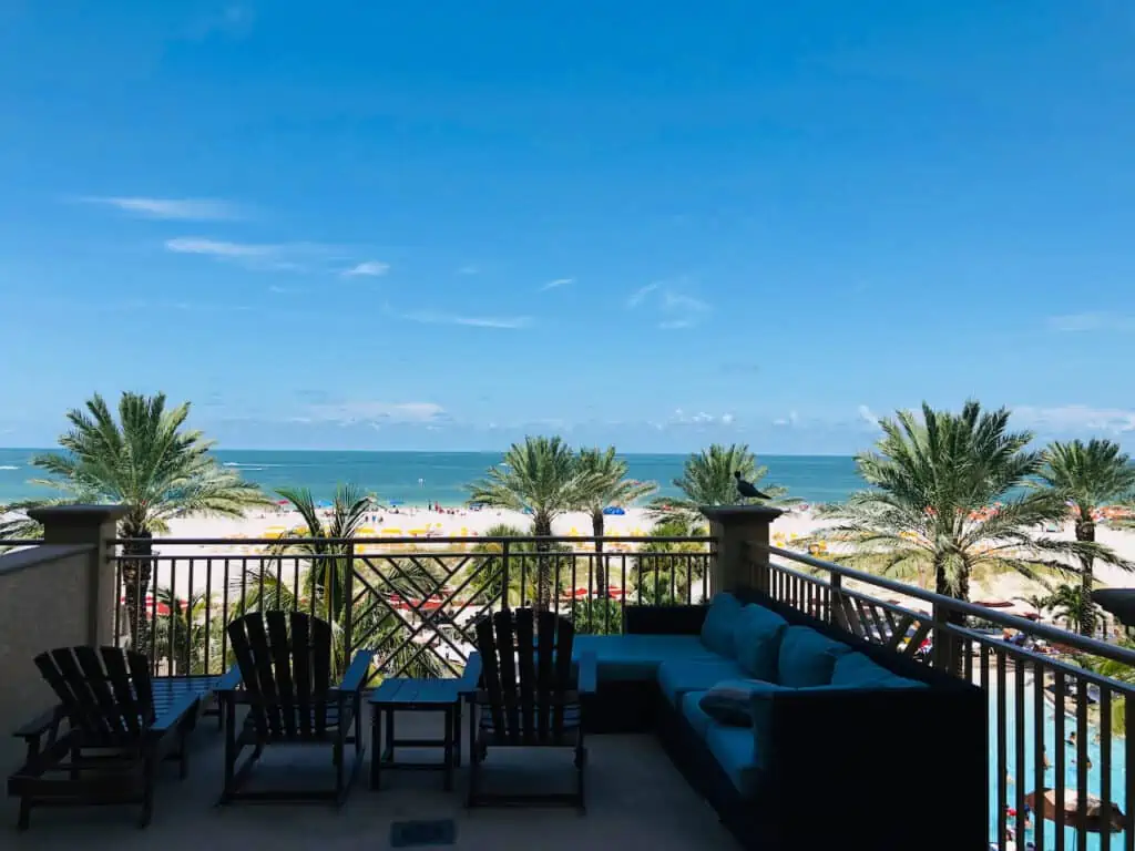 Photo of my large balcony room at our hotel, The Sand Pearl Resort in Clearwater Beach.  It is an ideal luxury hotel in Clearwater Beach. It shows the pool and the ocean below.