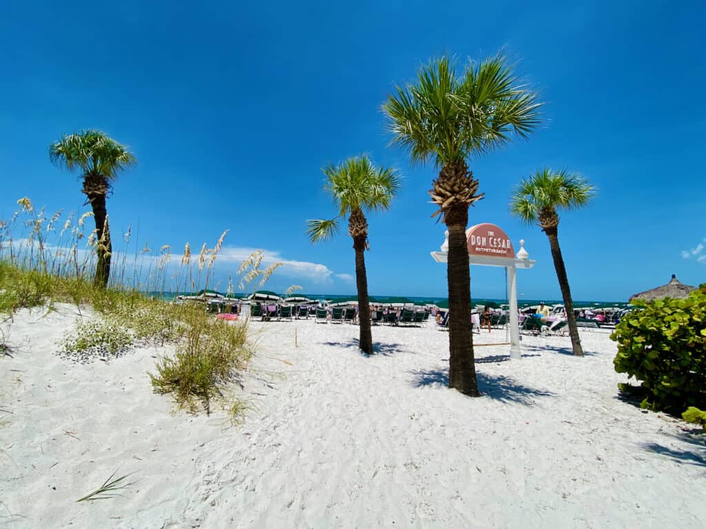 Don CeSar is located at St Pete Beach.  It has beautiful sugar sand, palm trees, beach chairs, and wide open Gulf of Mexico views. 