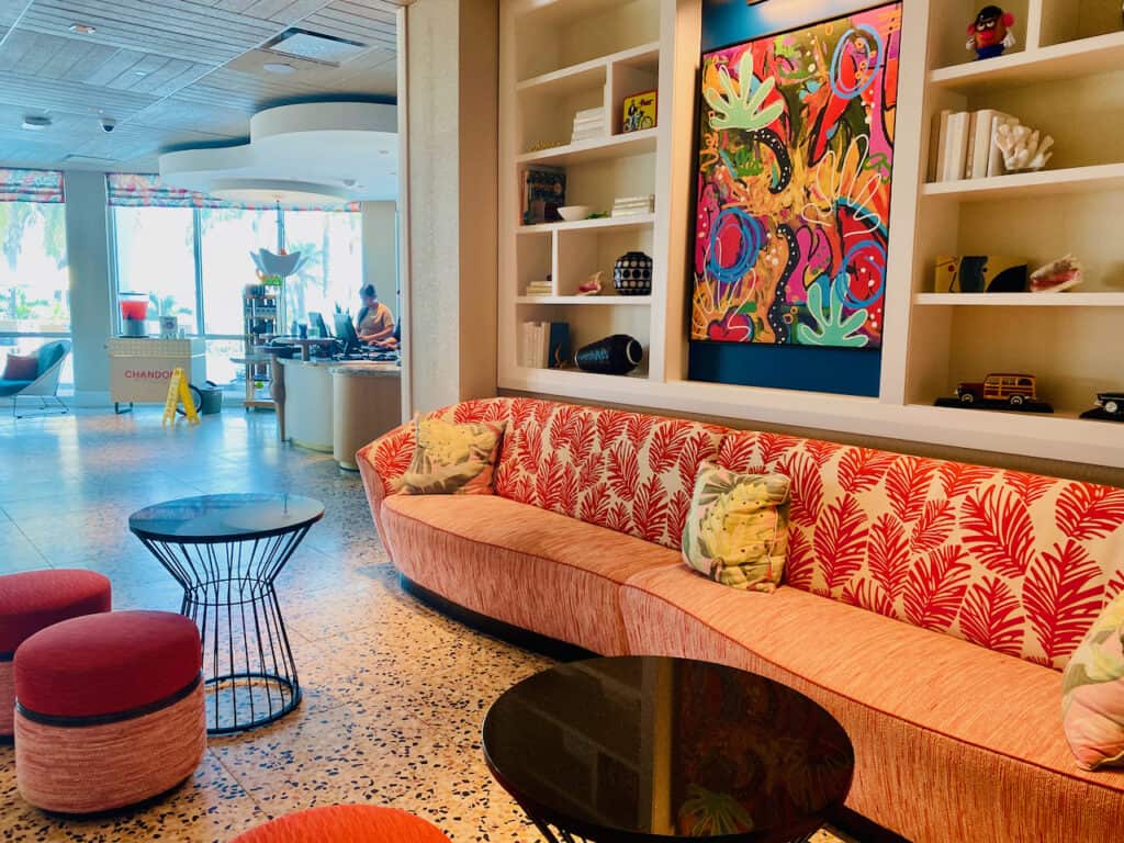 Hotel lobby photo with orange decor and beach vibes, St Pete Beach.  