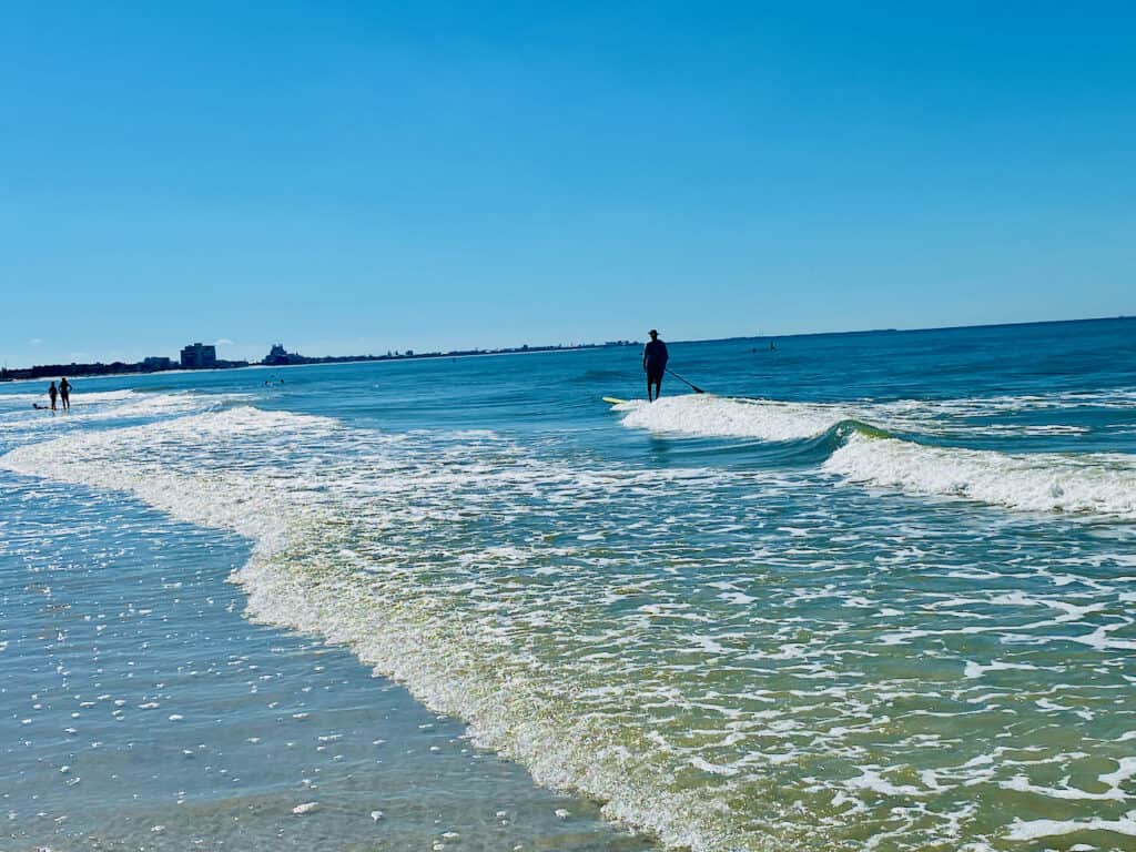 Paddle boarding at St Pete Beach outside the st pete beach hotels at Upham Beach.