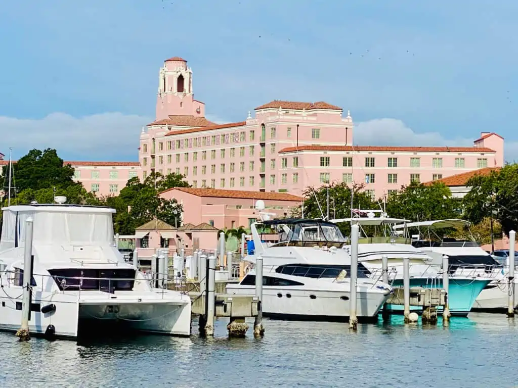 The Vinoy Renaissance Hotel photo showing the marina with boats in the forefront.  This is the well known historic hotel in downtown st petersburg fl, pink exterior.