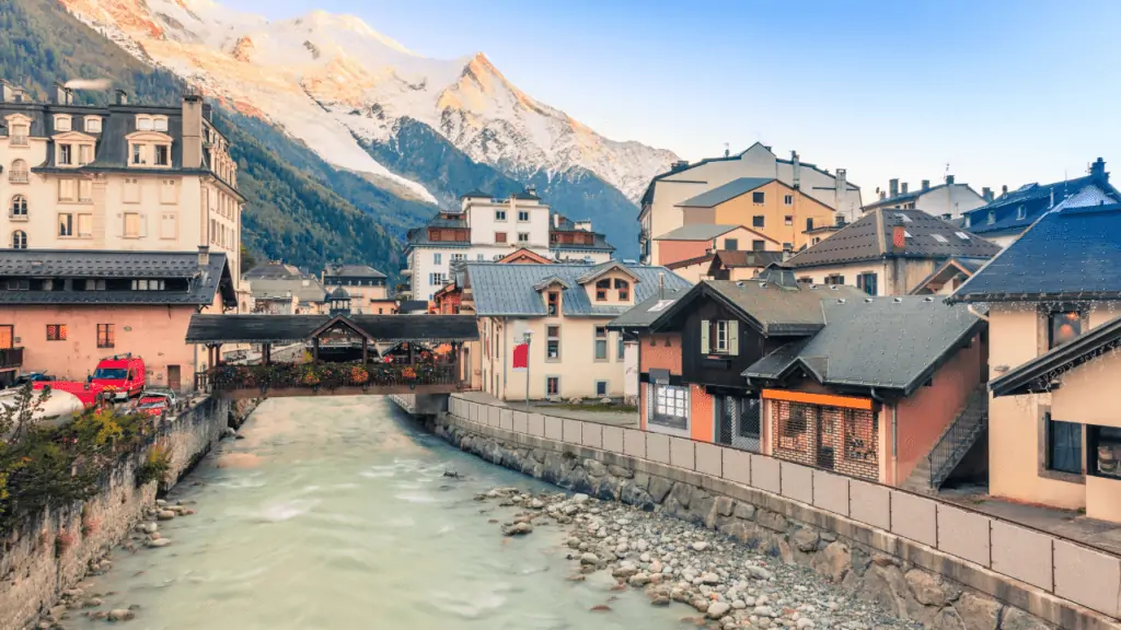 where to stay in chamonix france?  The centre of Chamomnix is a great option.  Photo shows the river running through the town with a gorgeous mont blanc view.
