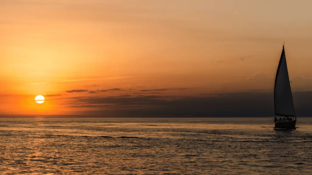 sailing sunset cruise with orange sunset