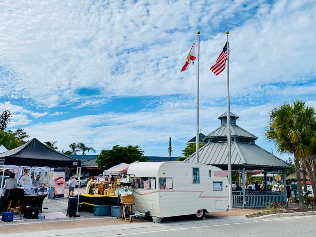 siesta key events in siesta key town showing the craft show in the center of town on ocean boulevard.