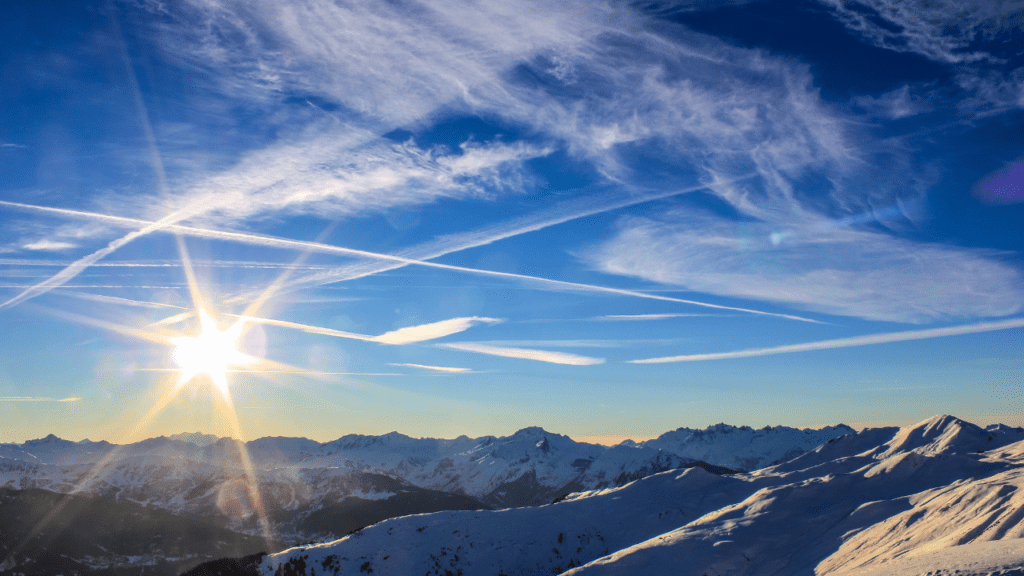 La Plagne is a French ski area in the alpine valley of the Tarentaise.  Photo shows mountain range with sunset.