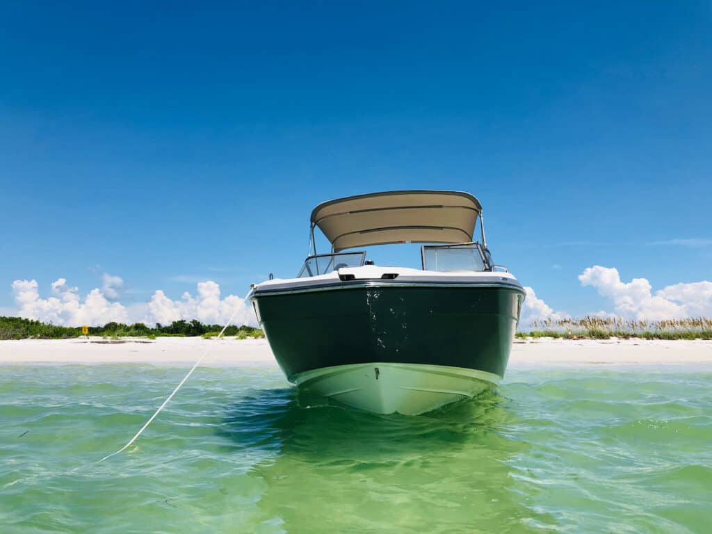 Shell Key Preserve with boat floating in the water on the beach