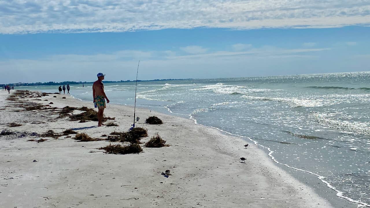 Siesta Key Boat Tours; Siesta Key photo of the beach and fishing genteman