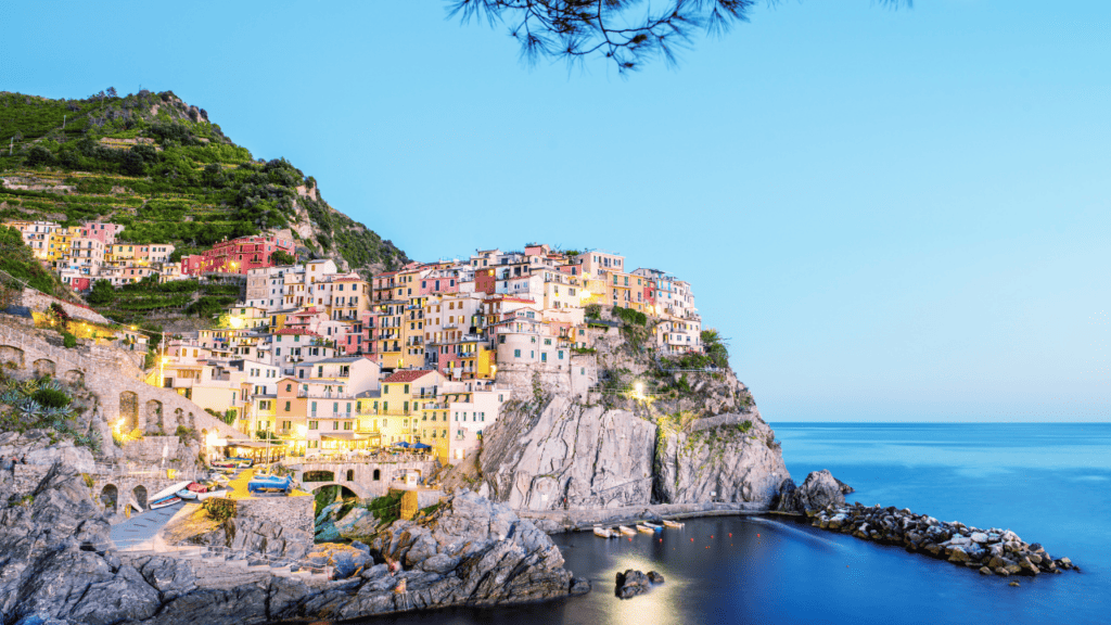 Manarola sunset view of the city and the pastel houses