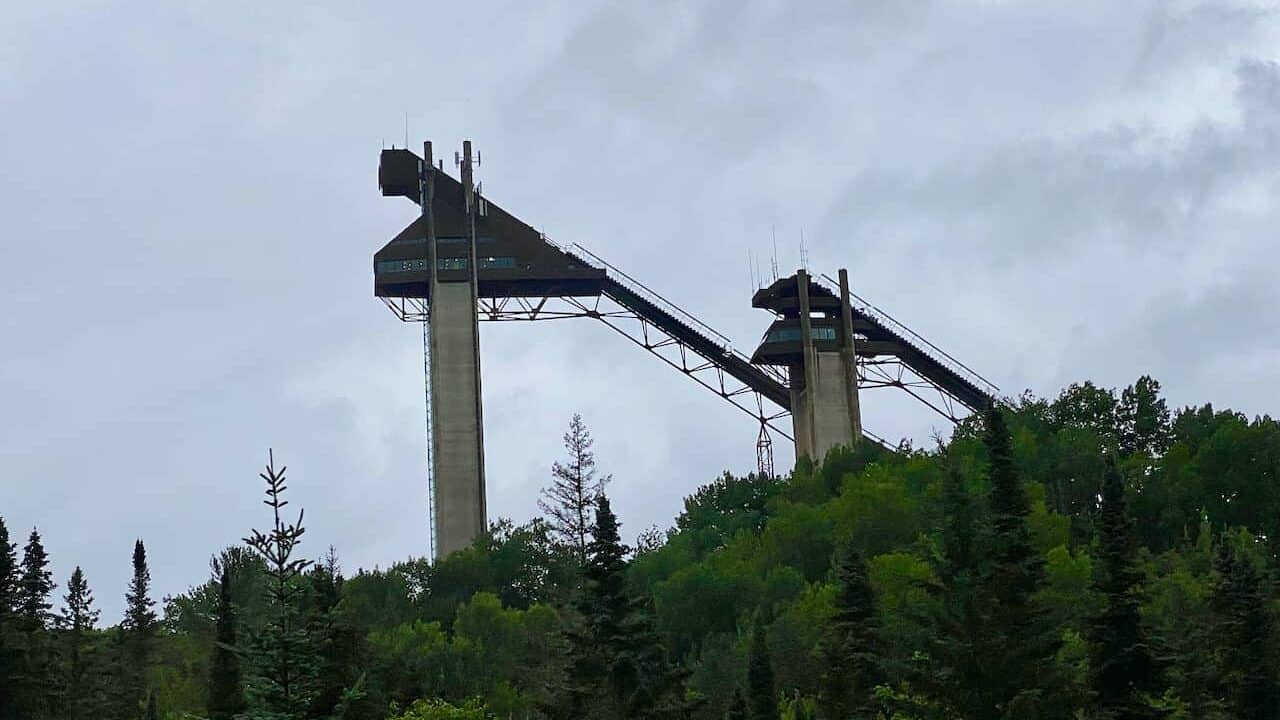 Olympic Jumping Center showing the jumps in the distance above the trees