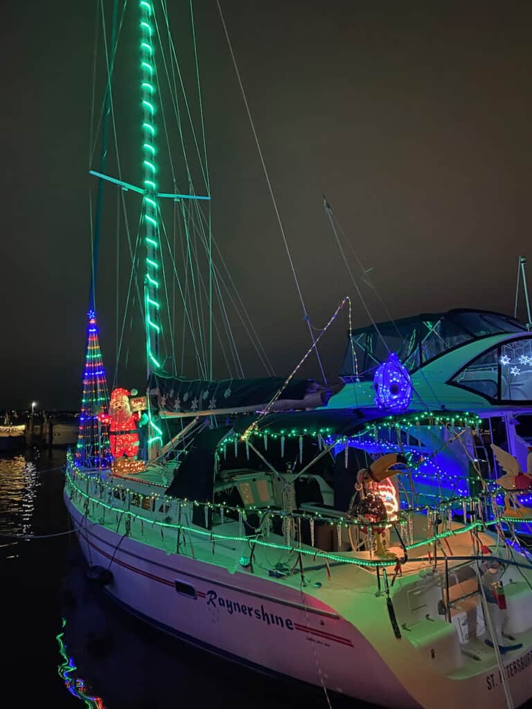 St Pete Beach boat parade showing a sail boat with lights on it.