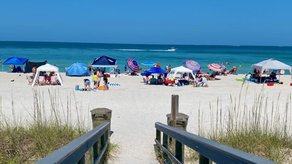 Groups of people under umbrellas at St Pete Beach