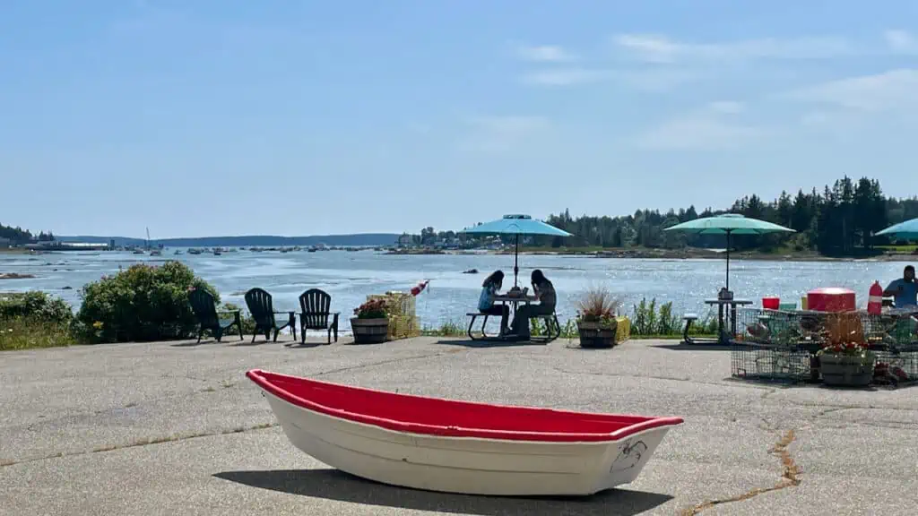  Archie's Lobster in Bass Harbor showing a boat with water views as diners eat