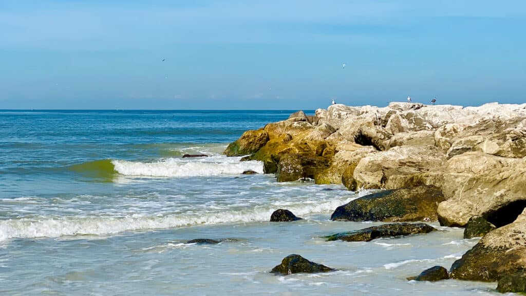 St Pete Beach Florida in October showing the waves and the rocks