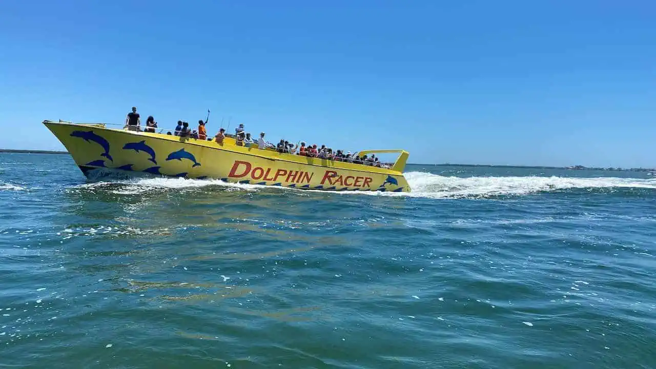 Dolphin Racer Tours is one of the fun things to do in St Pete Beach.  Photo was taken from water with the boat racing. It is a fun things to do in St Pete Beach with kids.