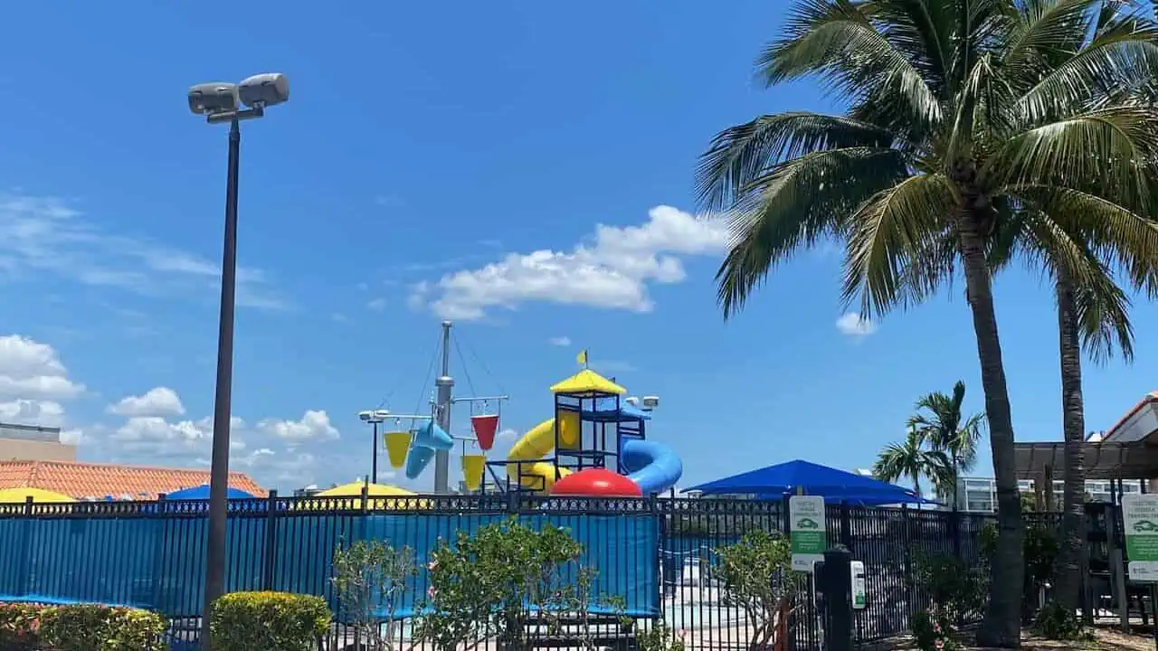 Colonel Michael J. Horan Park photo of the waterpark and palm trees. 